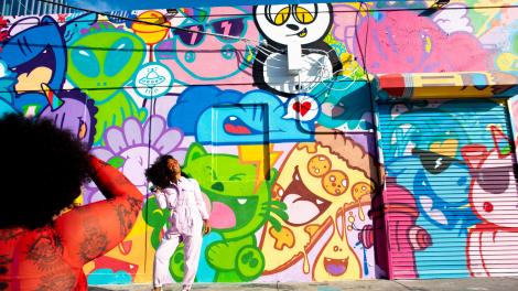 Posing in front of street art in the creative district of Wynwood Posing in front of street art in the creative district of Wynwood