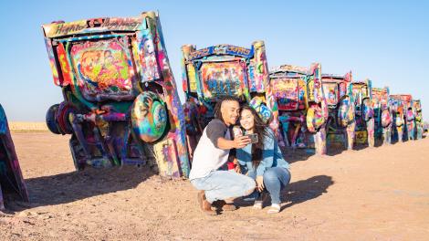 Posing for a selfie at Cadillac Ranch along historic Route 66 in Amarillo, Texas
