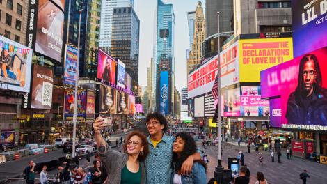 Snapping a selfie in bustling Times Square in the heart of Manhattan, New York City, New York