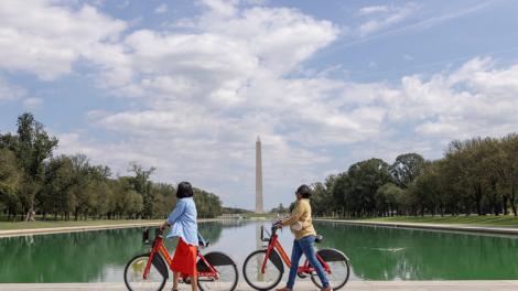 Biking on the National Mall in Washington, D.C., with the Washington Monument in the background