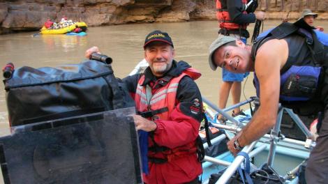 Greg on raft with camera