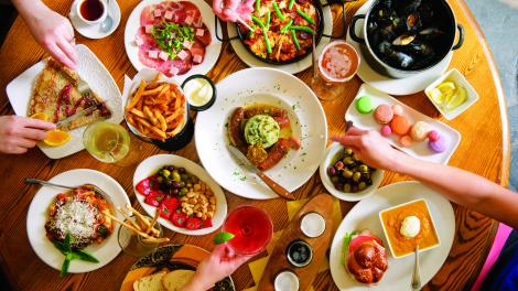 Diners share a selection of delicious farm-to-table meals.