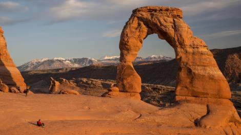 Sitting at the base of an arch in Moab, Utah Sitting at the base of an arch in Moab, Utah