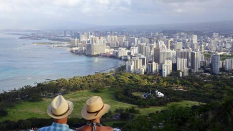 A couple admiring the Waikīkī cityscape in Hawaiʻi