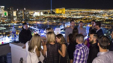 Socializing at a rooftop bar overlooking Las Vegas, Nevada