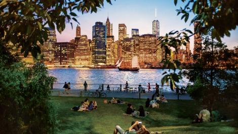 Lounging on the grass at Brooklyn Bridge Park in New York City