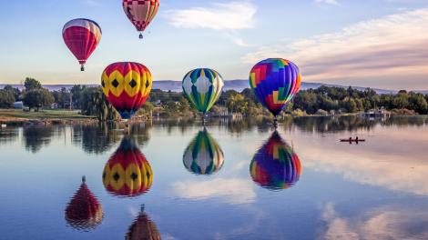 Hot-air balloons floating over the Yakima River Hot-air balloons floating over the Yakima River