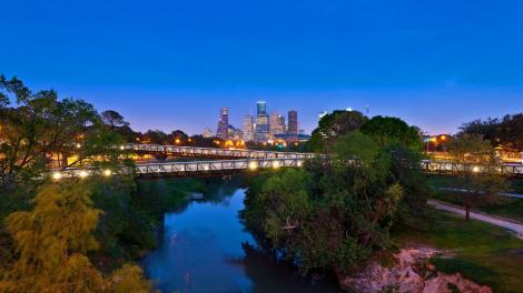 The Rosemont Bridge and the skyline of Houston, Texas, glistening at night