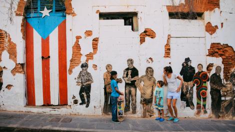 Posing with public mural art in Old San Juan, Puerto Rico