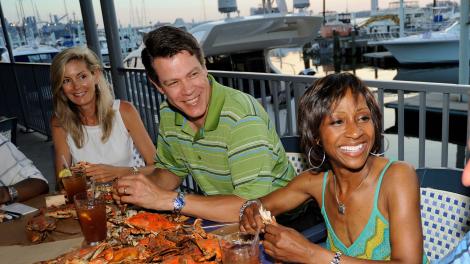 Feasting on steamed crab platters at a waterfront restaurant