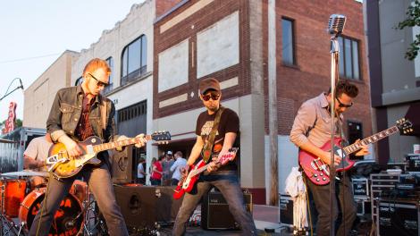 A band performing on the street in Florence, Alabama during the W.C. Handy Music Festival