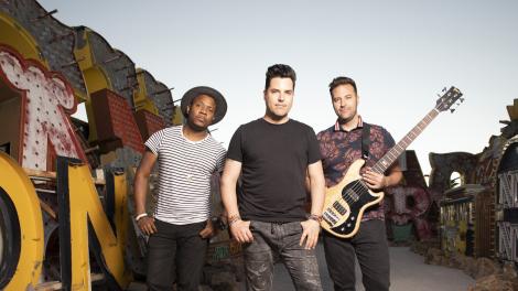 Frankie Moreno and his band posing at the Neon Museum in Las Vegas, Nevada