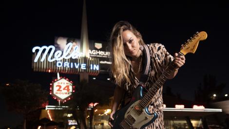 Rock musician Kat Meoz poses in front of Mel’s Drive-In in West Hollywood, California