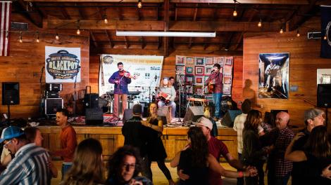 Dancing to live music during the Blackpot Festival & Cook-Off in Lafayette, Louisiana