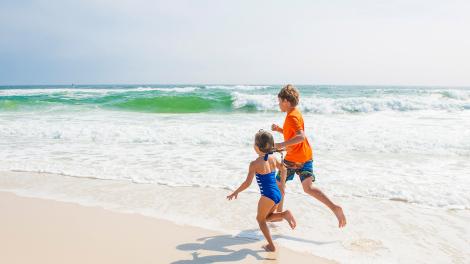 Kids playing on the beach on one of Pensacola’s Gulf of Mexico islands