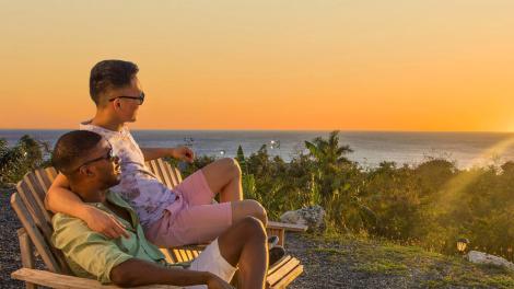 Couple watching the sunset in Rincon, Puerto Rico