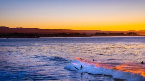 Surfing off the coast of Santa Cruz County in California