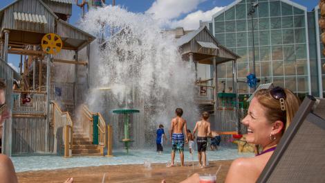 Couple watching as kids play at Cypress Springs Water Park in Gaylord Palms Resort and Convention Center in Kissimmee, Florida