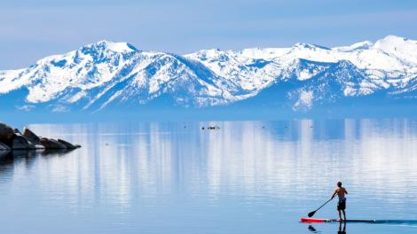 Paddleboarders exploring Lake Tahoe on the California and Nevada border