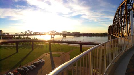 Sunset view from the Big Four Bridge, a pedestrian walkway over the Ohio River in Louisville, Kentucky  Sunset view from the Big Four Bridge, a pedestrian walkway over the Ohio River in Louisville, Kentucky