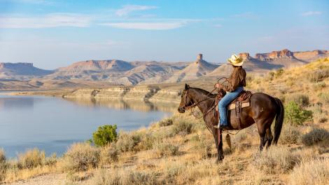 Horseback rider taking in views of Flaming Gorge National Recreation Area near Rock Springs, Wyoming