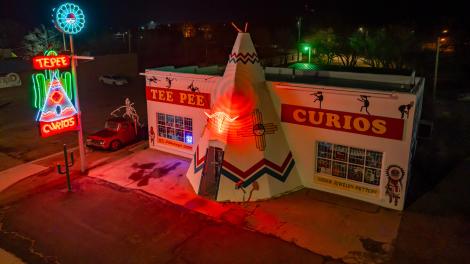 Neon signs illuminate the exterior of Tee Pee Curios in Tucumcari Neon signs illuminate the exterior of Tee Pee Curios in Tucumcari