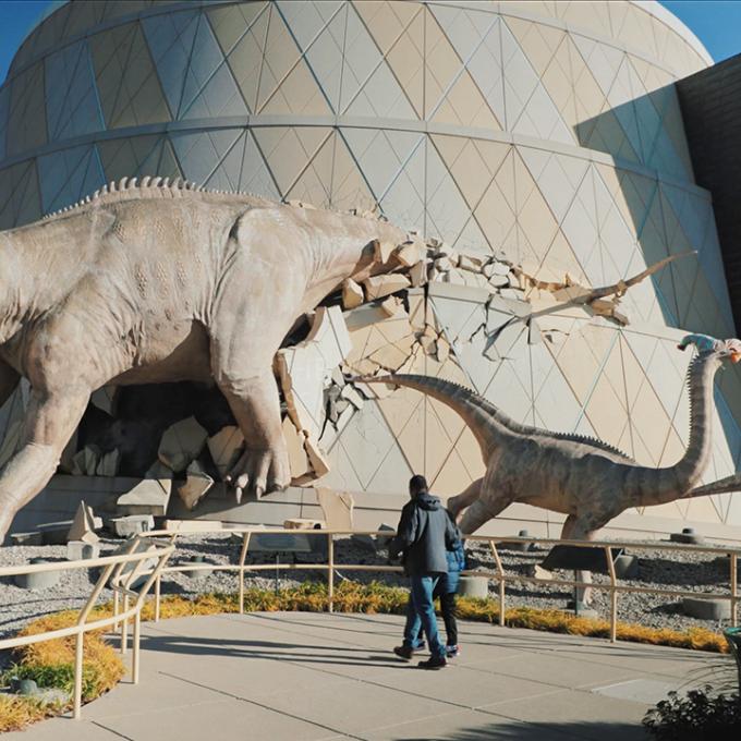 Father and son entering The Children's Museum of Indianapolis in Indiana Father and son entering The Children's Museum of Indianapolis in Indiana