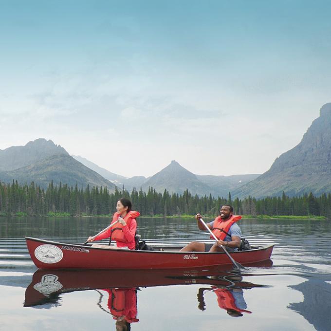 Canoeing on a lake in Glacier National Park, Montana Canoeing on a lake in Glacier National Park, Montana