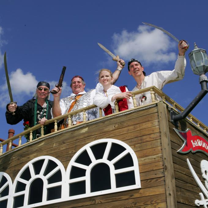 Pirates celebrating on a float at the Louisiana Pirate Festival Pirates celebrating on a float at the Louisiana Pirate Festival
