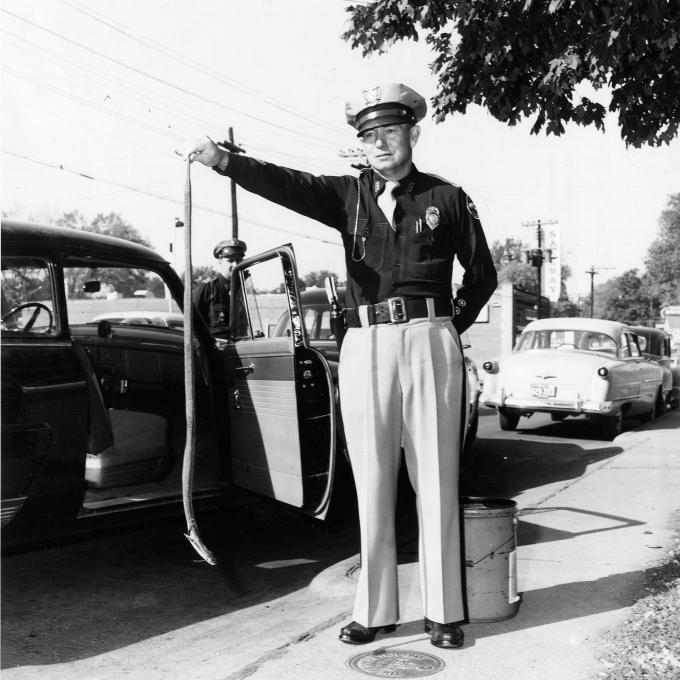 A Springfield police officer is photographed with a hooded cobra in 1953 A Springfield police officer is photographed with a hooded cobra in 1953