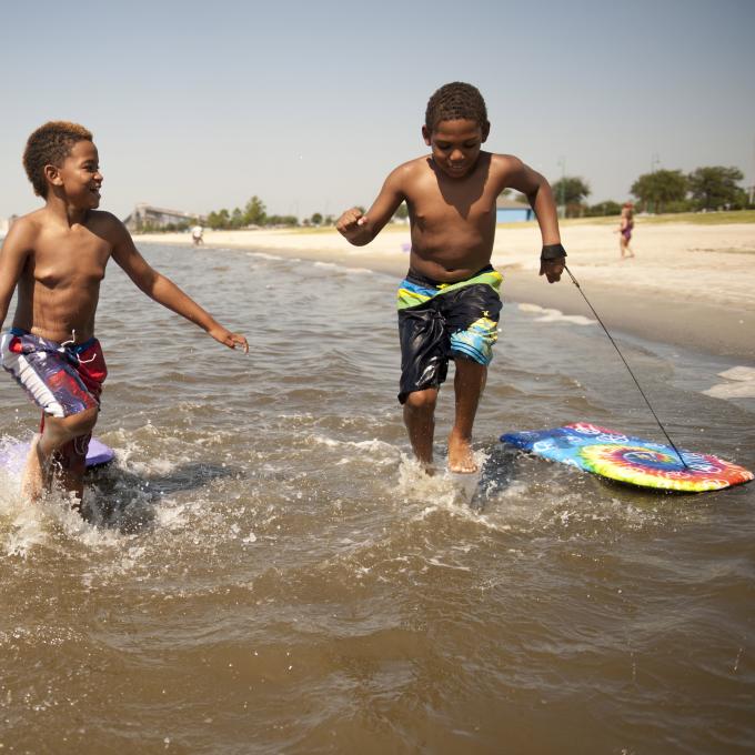Kids playing at North Beach in Lake Charles, Louisiana Kids playing at North Beach in Lake Charles, Louisiana
