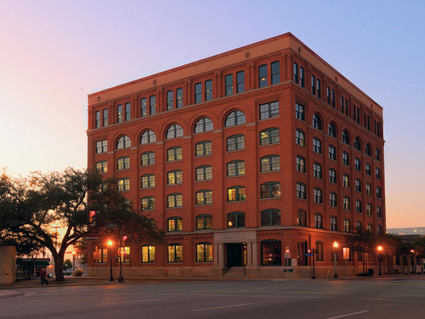 The exterior of the Sixth Floor Museum at sunset in Dallas, Texas