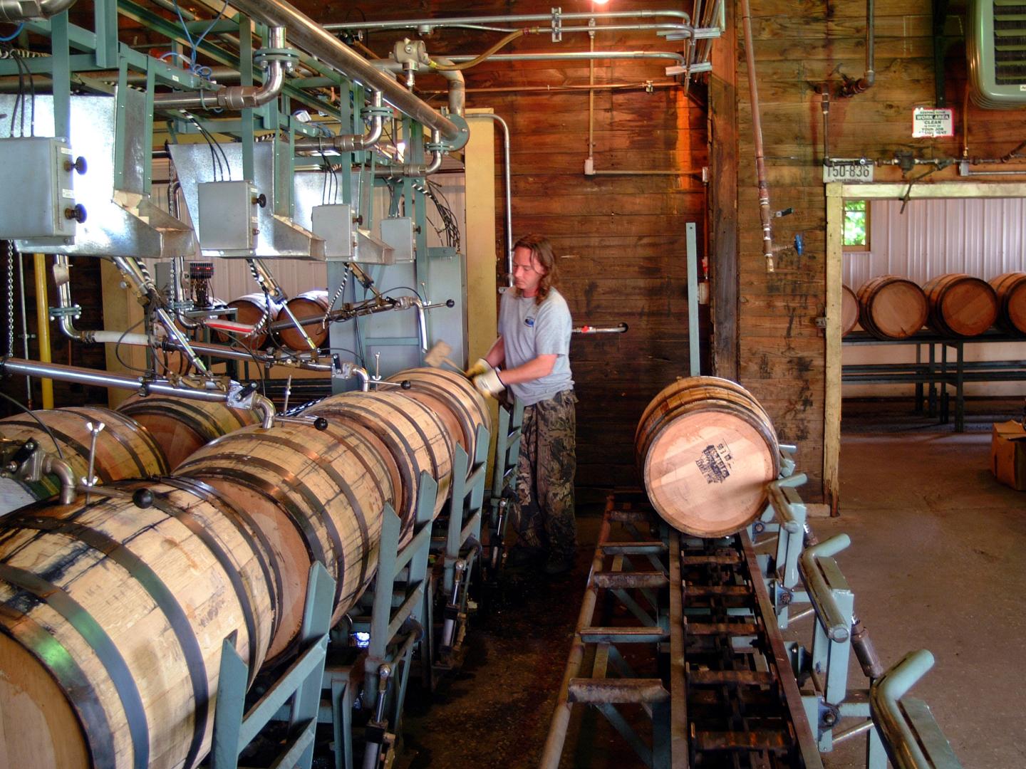 Filling bourbon barrels at the Wild Turkey Distillery in Lawrenceburg, Kentucky Filling bourbon barrels at the Wild Turkey Distillery in Lawrenceburg, Kentucky