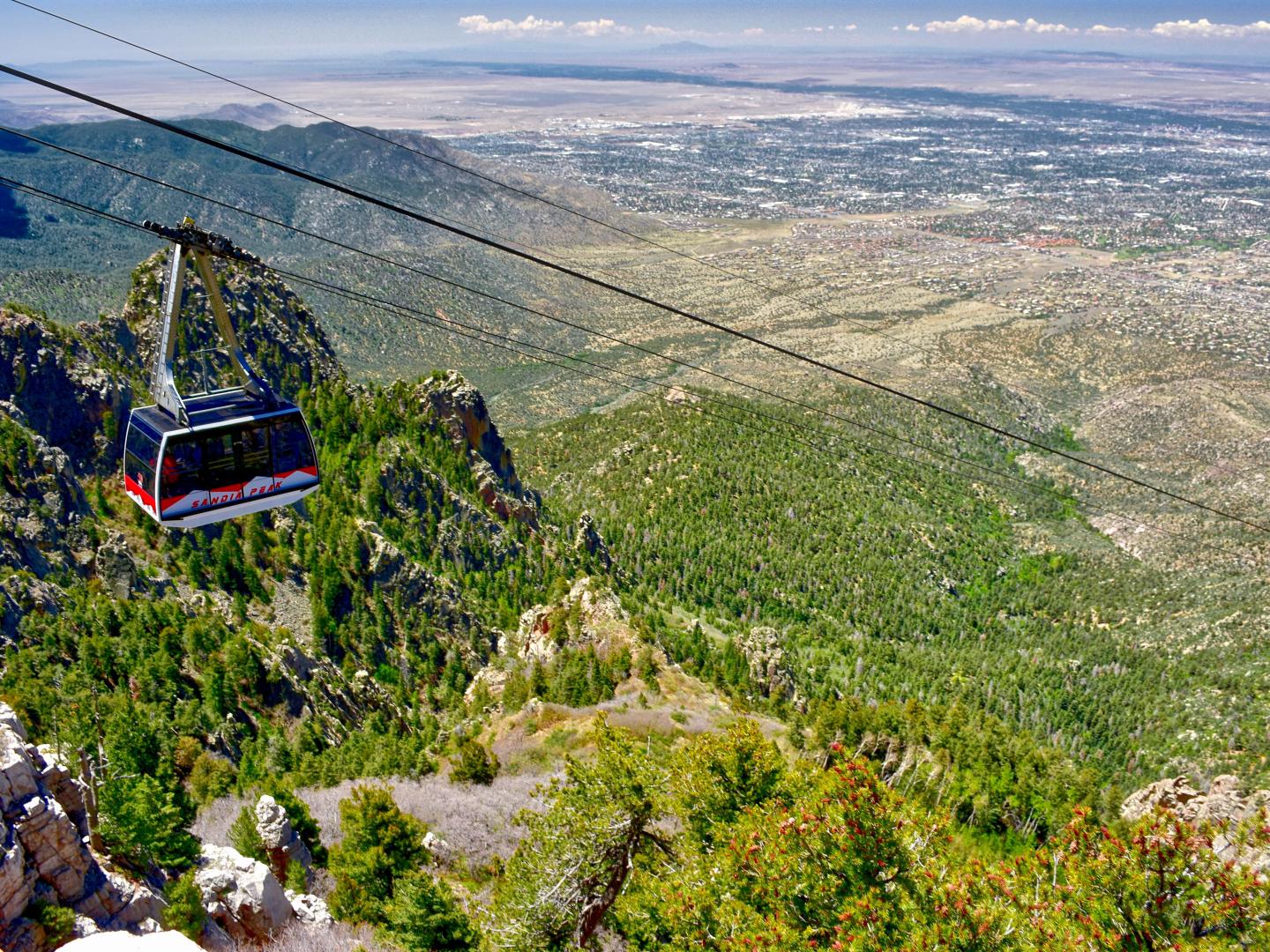 The Sandia Peak Aerial Tramway rises above Albuquerque, New Mexico