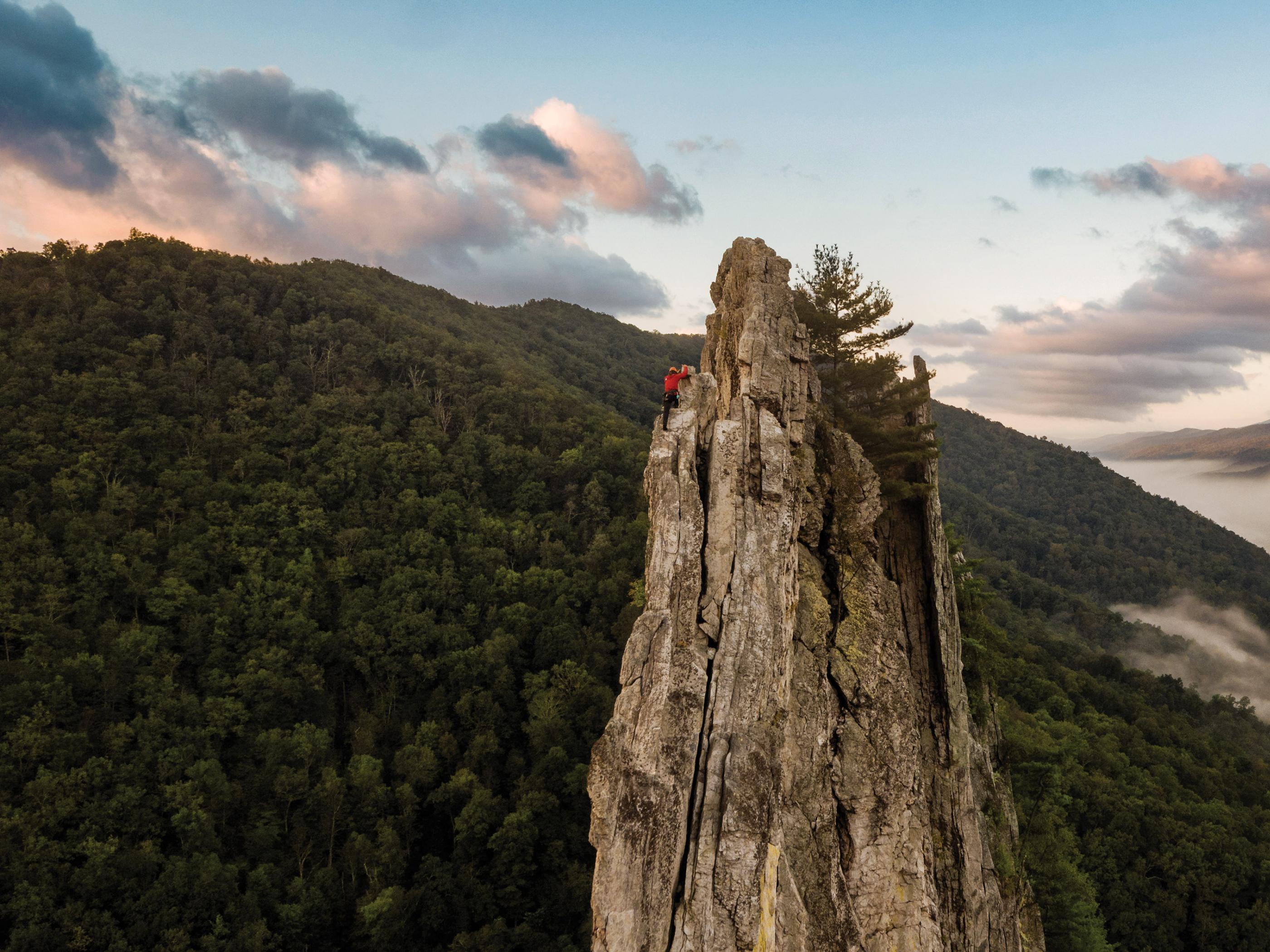 A rock climber near the summit of Seneca Rocks in West Virginia A rock climber near the summit of Seneca Rocks in West Virginia