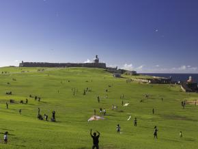 Flying kites on a sunny day at the El Morro Fort 