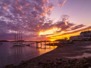 Sun rises on a fall morning over the Motor Inn and Mary Todd ship