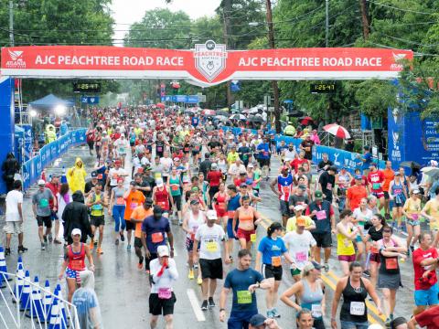 Runners finishing the Peachtree Road Race in Atlanta, Georgia Runners finishing the Peachtree Road Race in Atlanta, Georgia