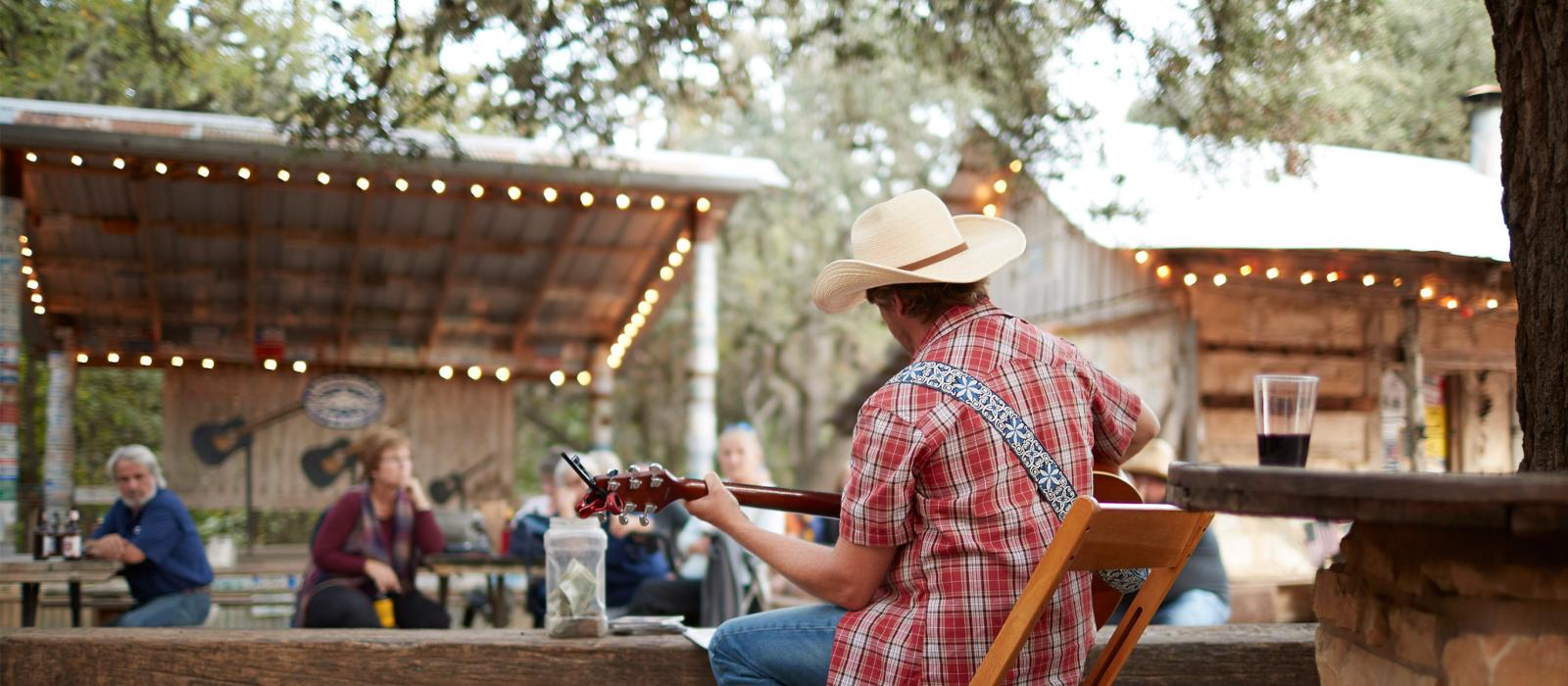 Playing an intimate backyard country concert in San Antonio, Texas