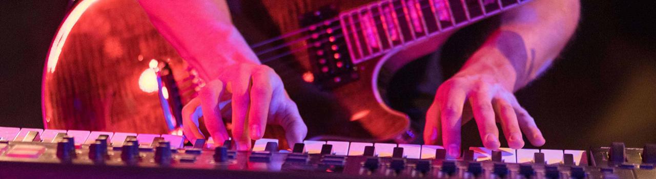 Playing the keyboard during an EDM show