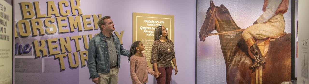 A family enjoys historical exhibits at the International Museum of the Horse in Lexington, Kentucky   A family enjoys historical exhibits at the International Museum of the Horse in Lexington, Kentucky