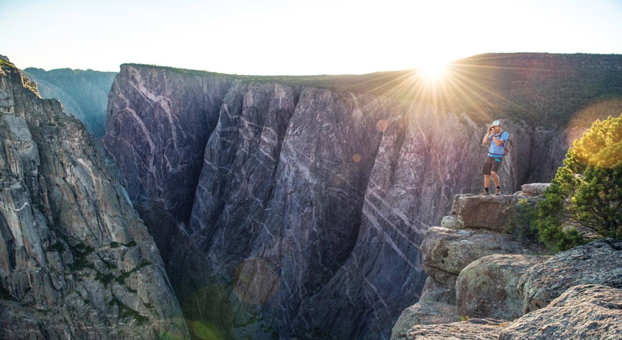 Hiker taking in the depths of the canyon