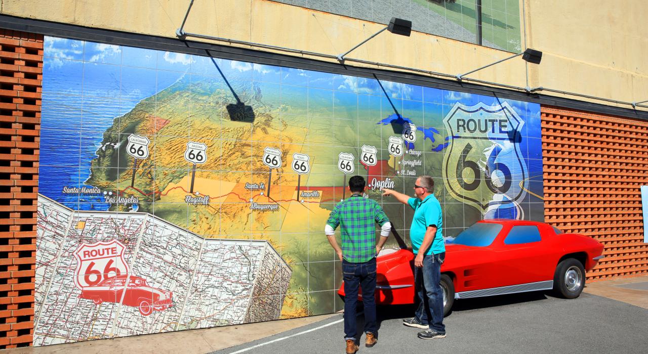 Admiring a Route 66 mural in Joplin, Missouri Admiring a Route 66 mural in Joplin, Missouri