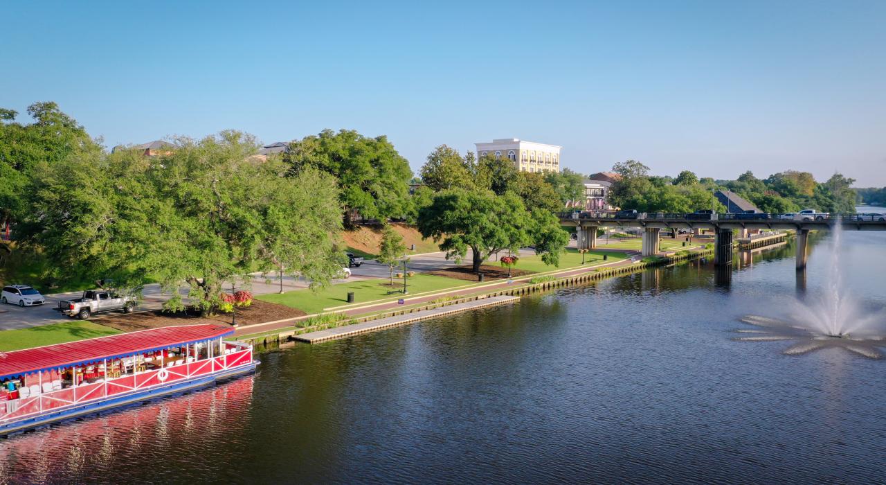 A tour boat on the riverbank