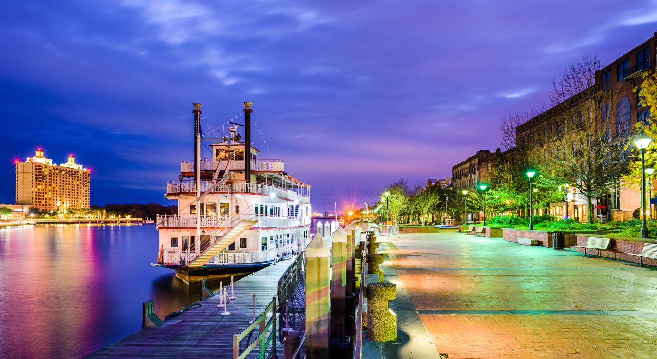 Riverboat docked along River Street with its boutiques, pubs and hotels Riverboat docked along River Street with its boutiques, pubs and hotels