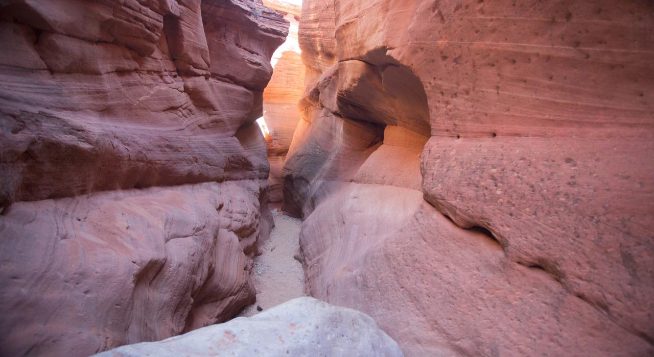 Hiking through the Peek-A-Boo Gulch slot canyon 