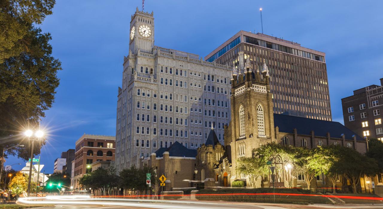 St. Andrew's Episcopal Cathedral and the Old State Capitol building at dusk