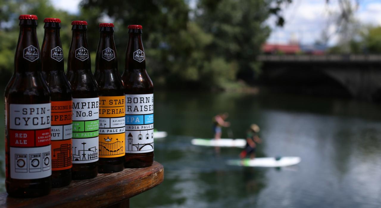 Overlooking craft beer options as paddle boarders float by No-Li Brewhouse Overlooking craft beer options as paddle boarders float by No-Li Brewhouse