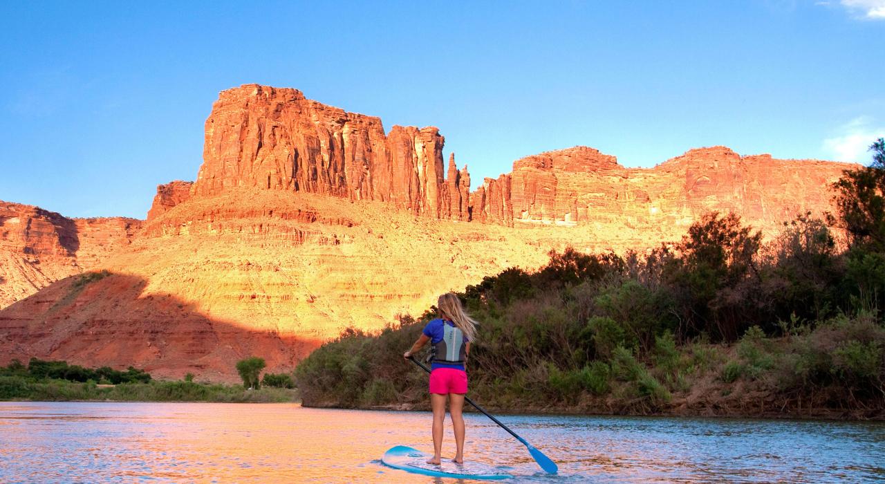 Stand-up paddleboarding on the Colorado River, which flows alongside the city Stand-up paddleboarding on the Colorado River, which flows alongside the city