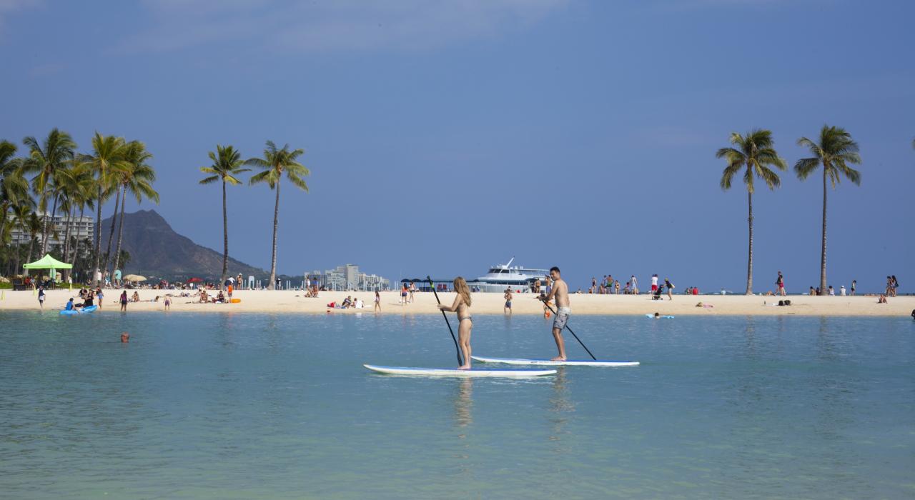 Stand-up paddleboarding in the lagoon at Hilton Hawaiian Village Waikiki Beach Resort in Honolulu